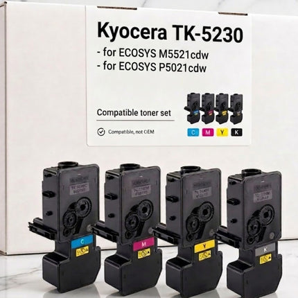 Foto des kompatiblen TK-5230 Vierfarbensets; zusätzlich gehört eine zweite schwarze Kartusche zum Angebot